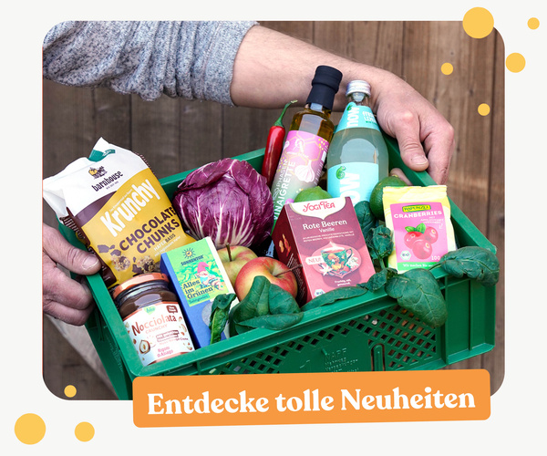 KI generiert: Eine grüne Kiste mit Lebensmitteln. Text: "Entdecke tolle Neuheiten".